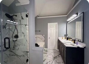 Shower, hair dryer, towels, toilet paper