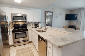 Lägenhet Signature - 1 sovrum - balkong - utsikt mot stranden | Eget kök | Kylskåp, mikrovågsugn, ugn och spishäll