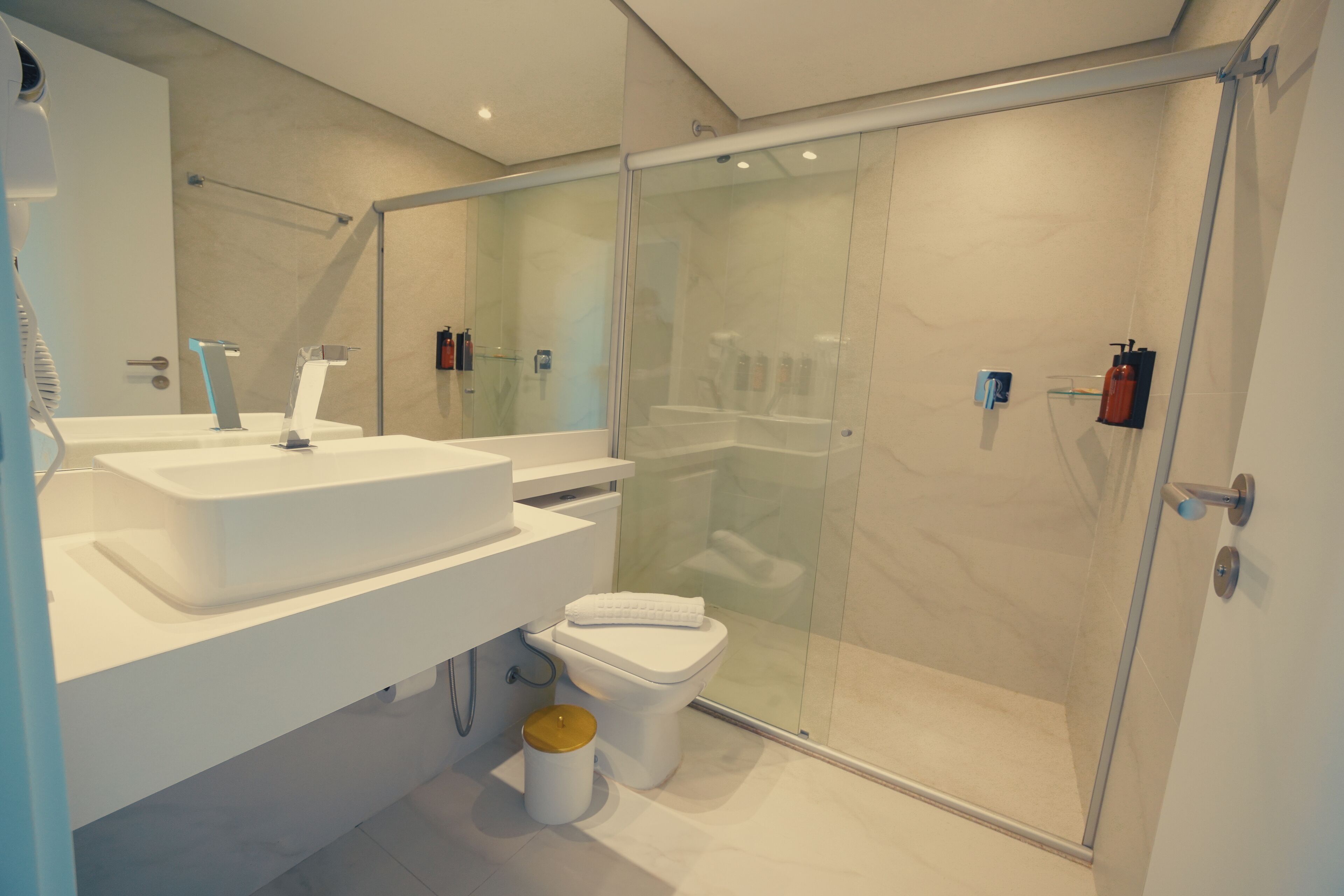 Hair dryer, towels, soap, shampoo