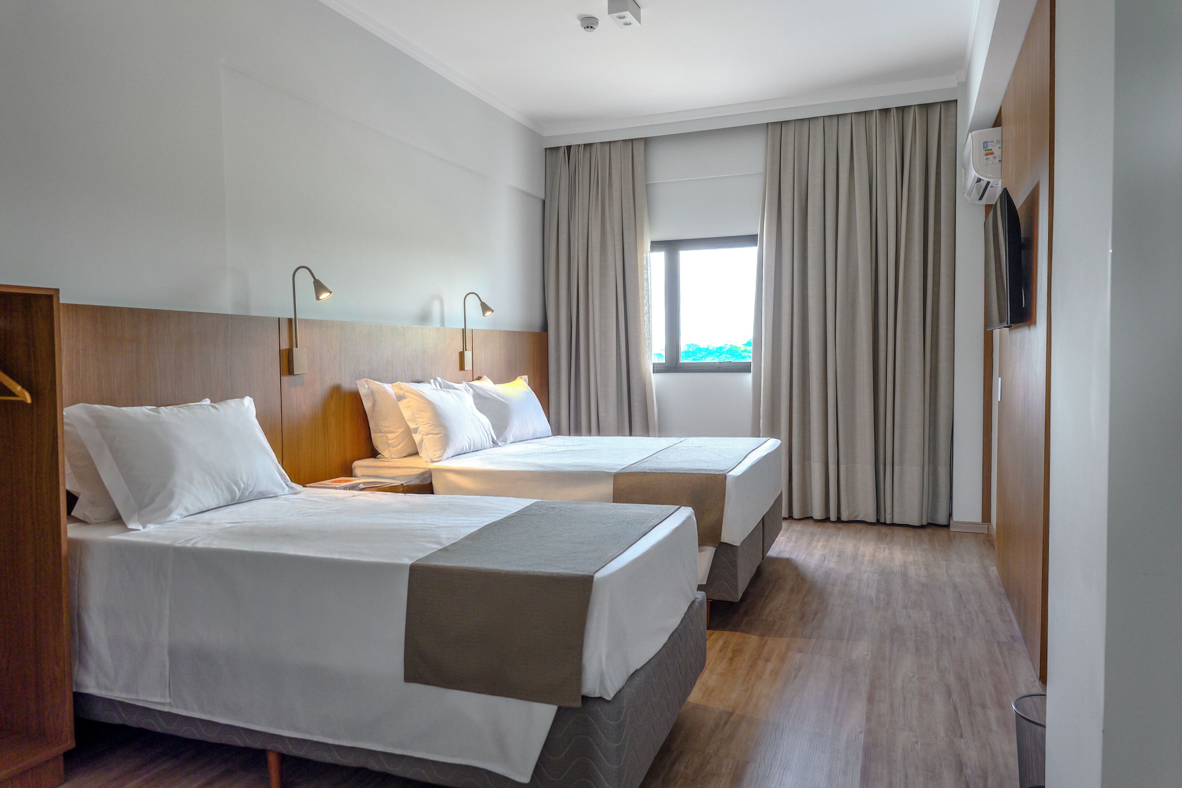 Comfort Triple Room, City View | Laptop workspace, blackout drapes, soundproofing, iron/ironing board