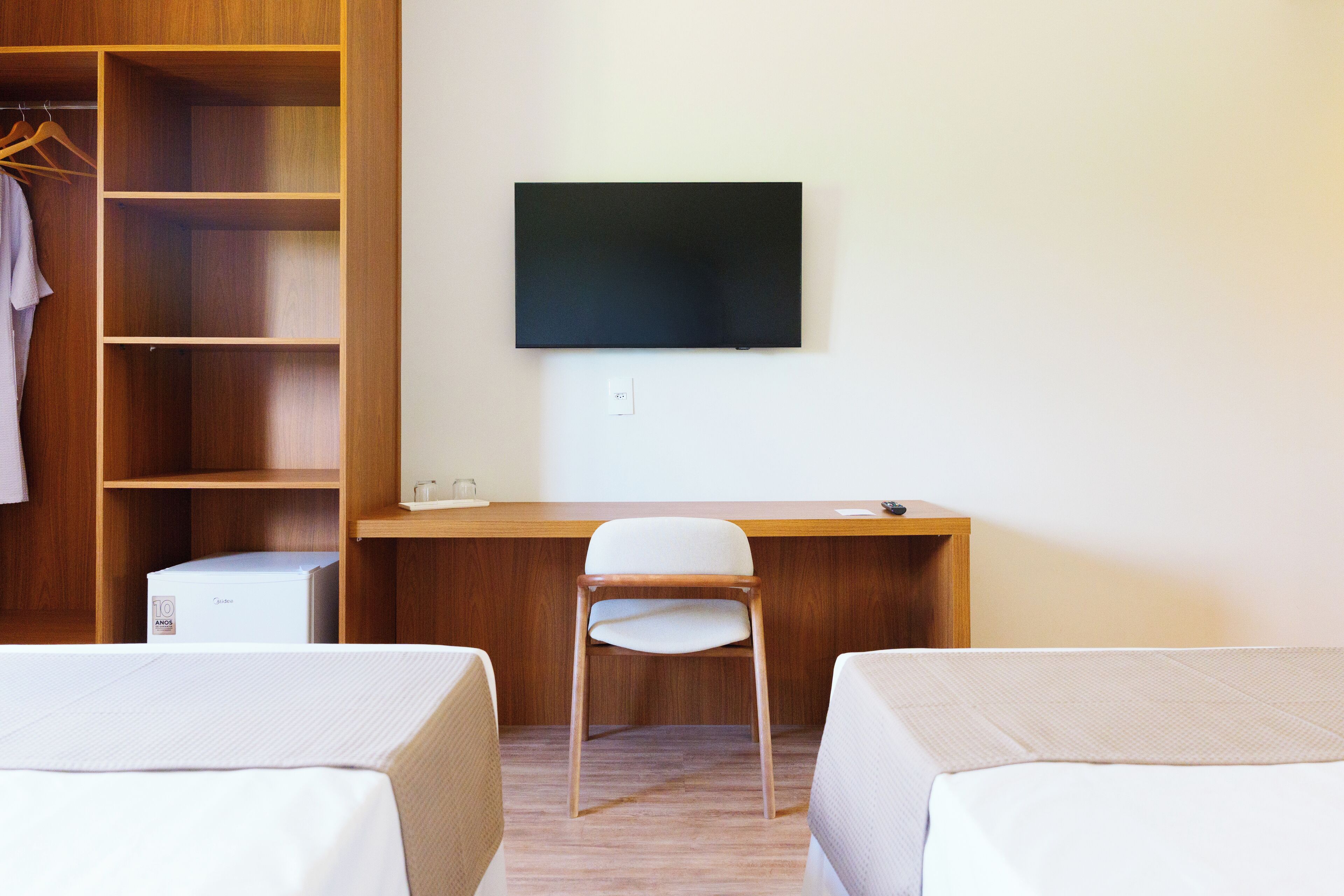 Deluxe Triple Room, City View | Laptop workspace, blackout drapes, soundproofing, iron/ironing board