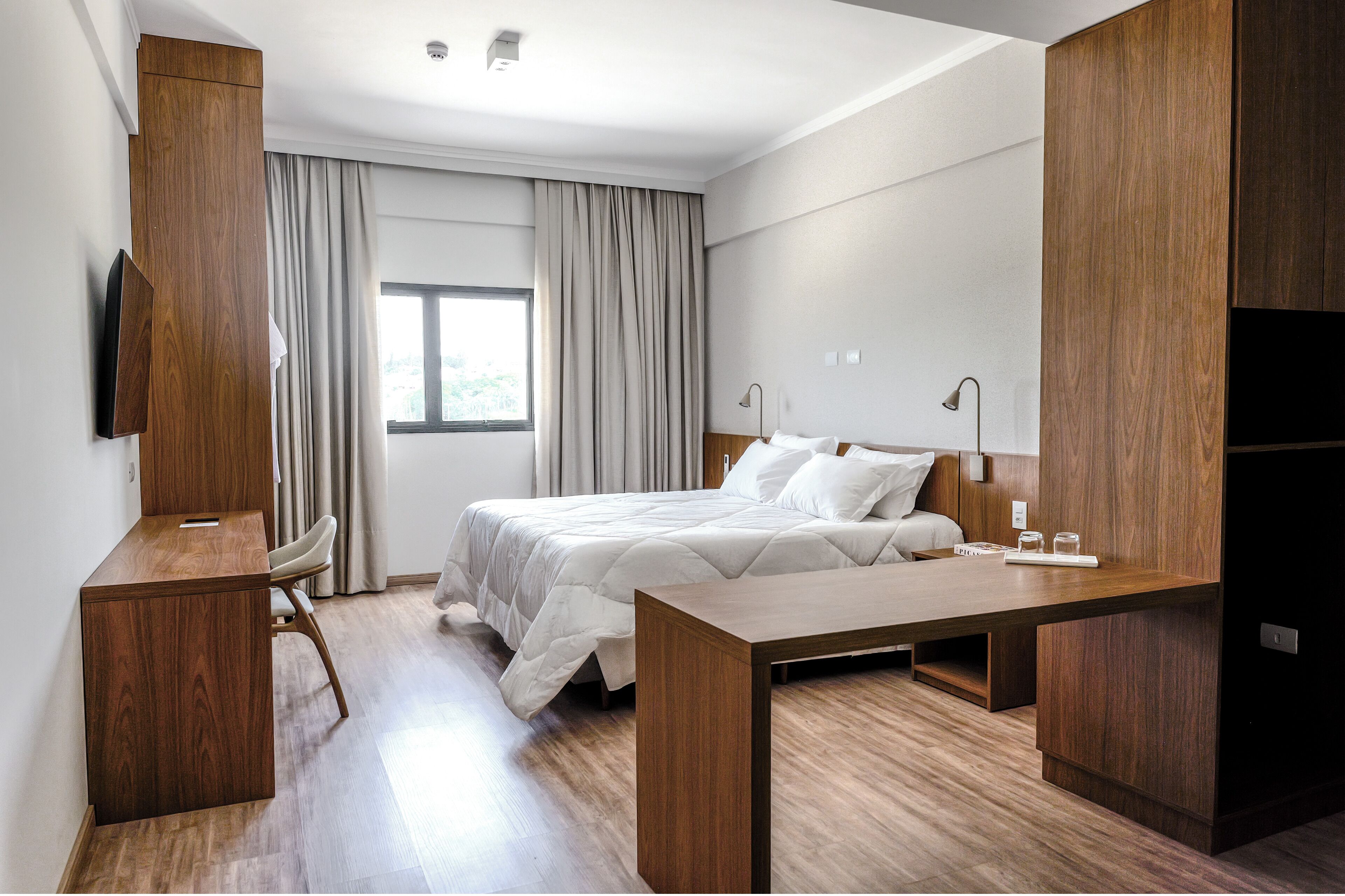 Deluxe Studio Suite, City View | Laptop workspace, blackout drapes, soundproofing, iron/ironing board