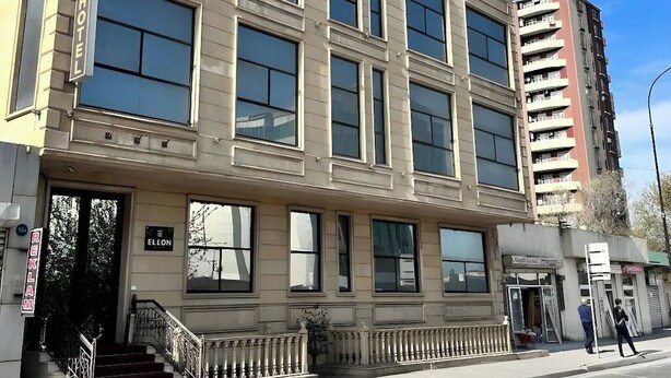 The ELEON HOTEL building with a classic architectural style, featuring large windows and a prominent entrance. - Eleon Hotel (Baku)