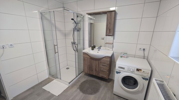 Shower, hair dryer, towels, soap