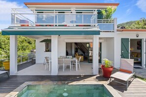 A two-story house with a balcony and a swimming pool. - Villa Arlet - Three Bedroom Villa, Sleeps 6 (Les Anses-d'Arlet)