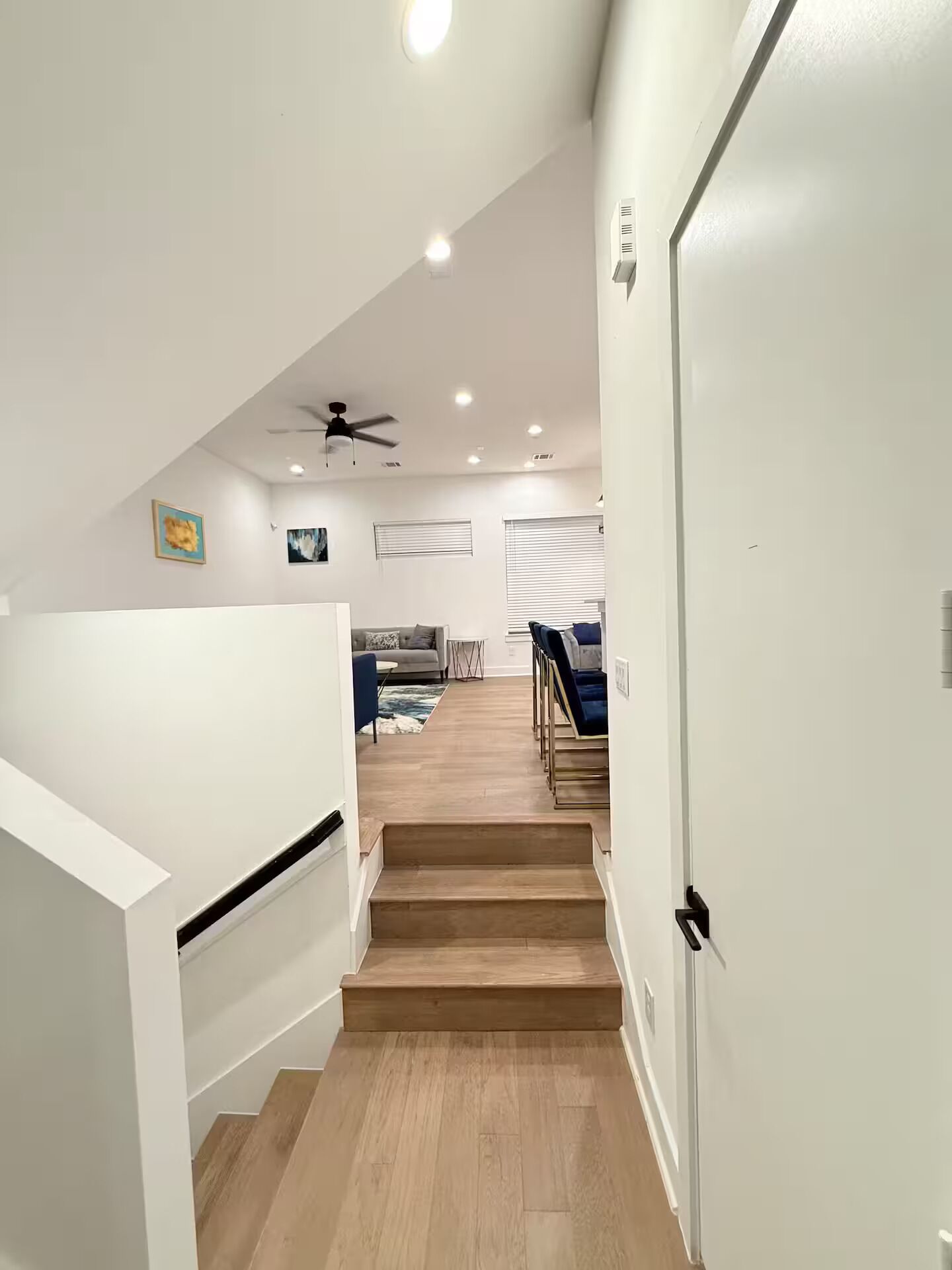 A modern interior with a staircase leading to a living area.