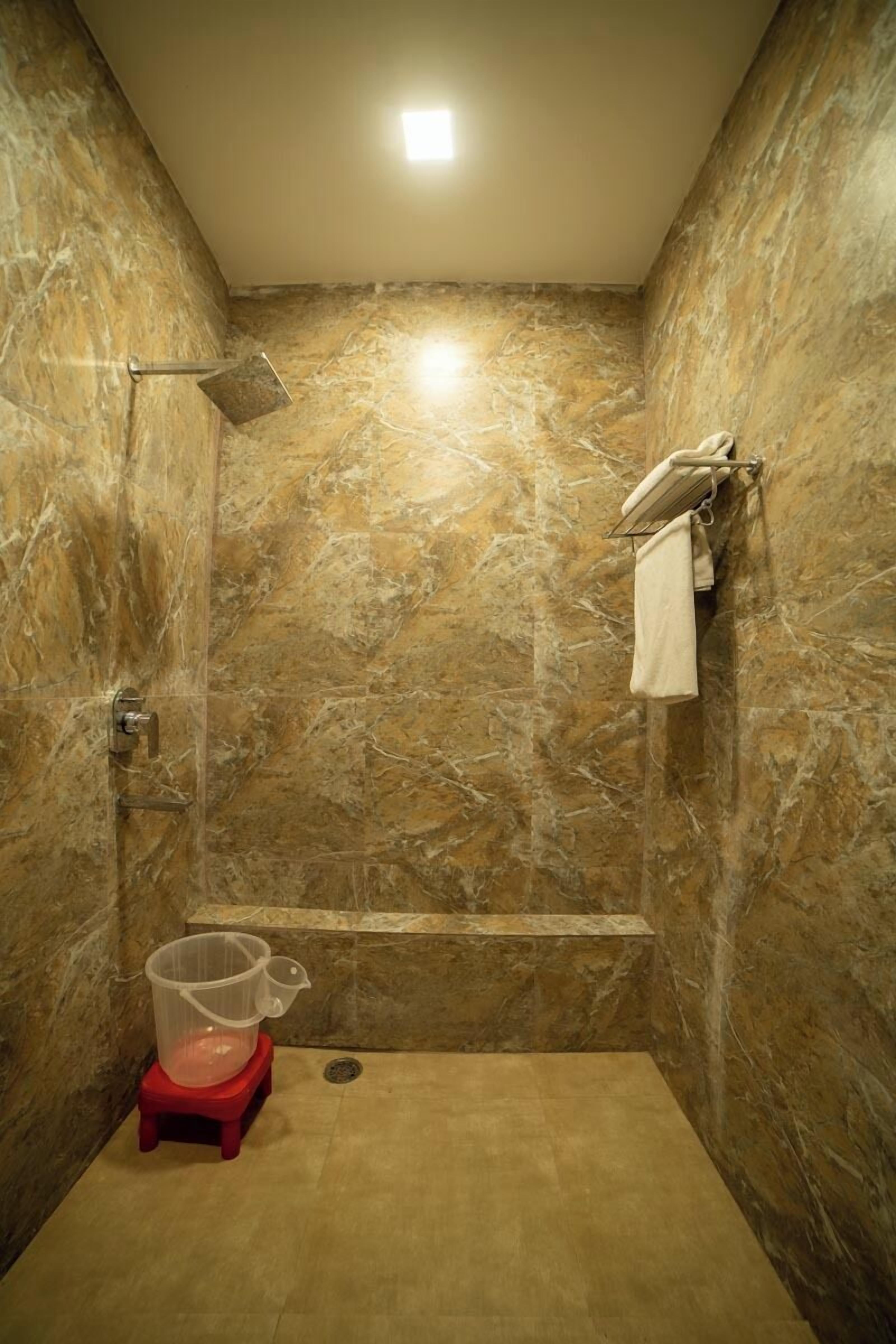 Family Suite, Lake View | Bathroom | Shower, slippers, towels, soap