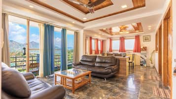 Family Suite, Lake View | Living area | TV