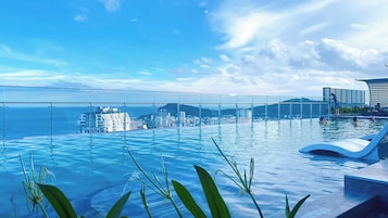 Outdoor pool, sun loungers, lifeguards on site