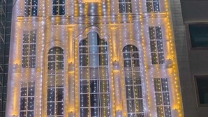 The exterior of the Pacific Prime luxury hotel with illuminated string lights and a prominent entrance. - Hotel Pacific Primee (Zirakpur)