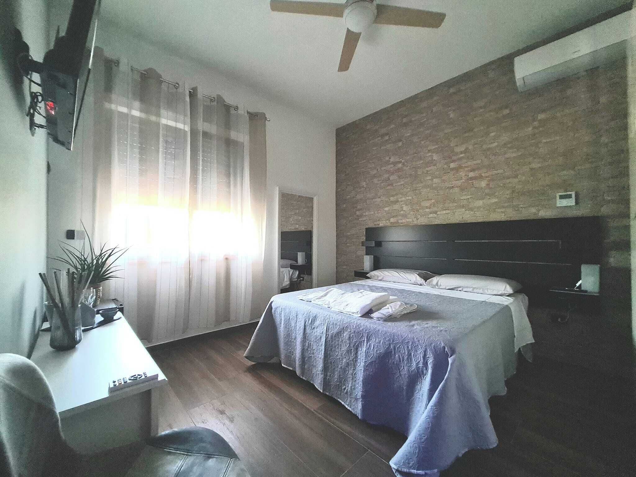 Habitación cuádruple Deluxe, vistas a la montaña | Ropa de cama de alta calidad y edredones de plumas