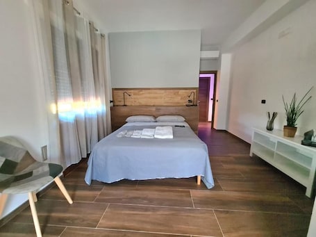 Deluxe Quadruple Room, Mountain View | In-room safe, soundproofing, iron/ironing board, free WiFi