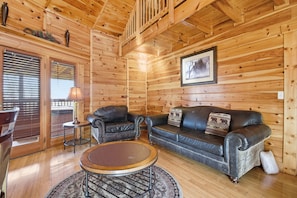 Executive Cabin, 2 Bedrooms, Hot Tub, Mountain View | Living room | 40-inch Smart TV with digital channels, foosball - Just Hanging Around (Sevierville)