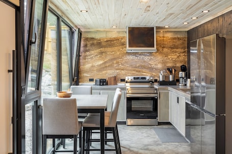 Fridge, oven, stovetop, dishwasher. Private Rammed Earth Cabin: Soaking Tub & Kitchen