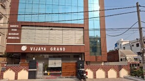 A building with a sign for 'VIJAYA GRAND' offering banquets, rooms, a restaurant, and a conference hall. - HOTEL VIJAYA GRAND  (Patna)