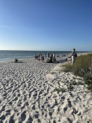 A sandy beach with people and beach chairs. - Private Heated Pool-Near Naples Beaches-2BR/2BA (Naples)