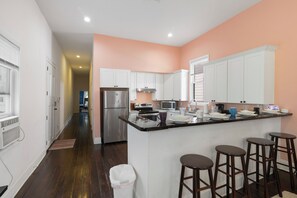 Fridge, microwave, oven, stovetop - Cute and Cozy 2BR/2BA w/Parking, Yard, King Suite & Blocks to Local Favorites (New Orleans)