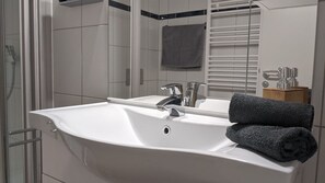 Shower, hair dryer, towels