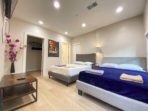 Comfort Quadruple Room, Private Bathroom | Desk, laptop workspace, blackout drapes, soundproofing - Comfort Suites BnB (Los Angeles)