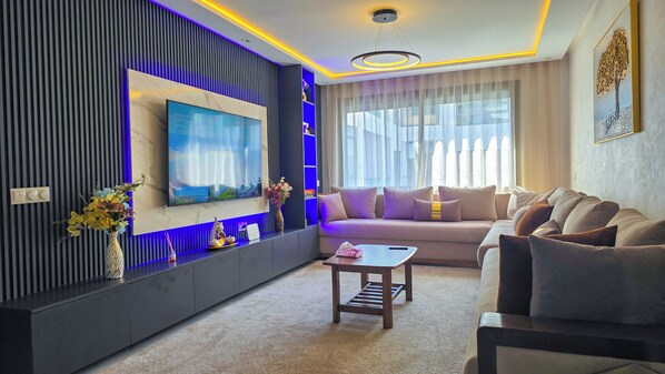 Grand Apartment, 3 Bedrooms, Balcony | Living area | 65-inch Smart TV with satellite channels, Netflix, streaming services - Luxury Living - Near to football stadium (Tangier)