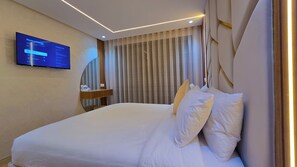 Appartement Majestueux, 3 chambres, balcon | Coffres-forts dans les chambres, fer et planche à repasser