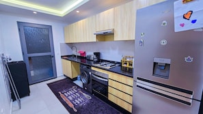 Apartamento grand, 3 quartos, sacada | Cozinha privada | Fogão, cooktop, máquina de café expresso, cafeteira/chaleira