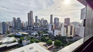 A cityscape with high-rise buildings, roads, and some greenery. - COCAR0115 - Salvador Prime (Salvador)