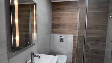 Departamento, vista al jardín | Baño