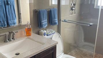 Shower, hair dryer, towels, soap