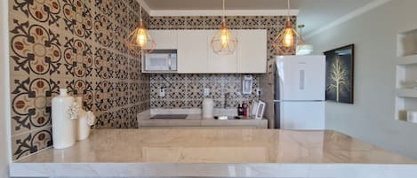Basic Apartment | Private kitchen | Fridge, microwave, cookware/dishes/utensils
