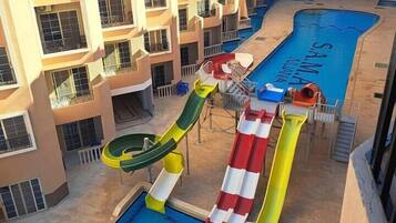 2 outdoor pools, open 7:00 AM to 6:00 PM, pool umbrellas, pool loungers