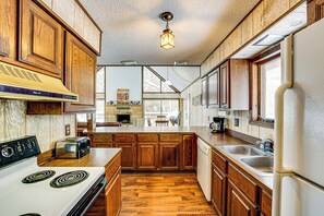 Fridge, microwave, stovetop, dishwasher - Pere Marquette Riverfront Cabin w/ Fishing Access (Baldwin)