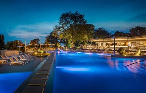 A pool area with lounge chairs and a bar area. - Awesome home in Novigrad with swimming pool (Novigrad)