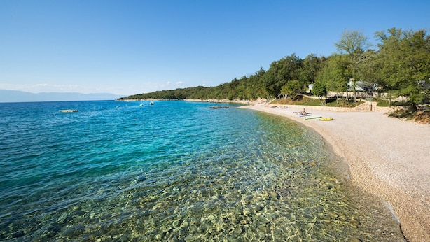 A clear beach with rocky shorelines, a sandy path, and a forested area. - Lovely home in Njivice with swimming pool (Njivice)