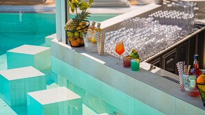 A poolside bar area with a variety of drinks, glasses, and a pineapple. - Gorgeous home in Njivice with WiFi (Njivice)