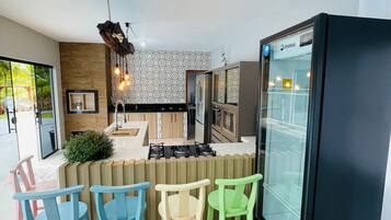 Honeymoon Cabin, Jetted Tub, Pool View | Private kitchen | Dining tables