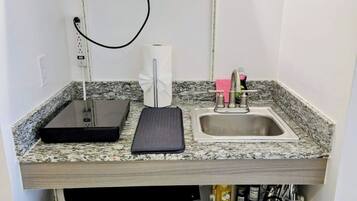 Microwave, coffee/tea maker, cookware/dishes/utensils