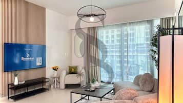 Appartement Deluxe, balcon, vue ville | Salle de séjour