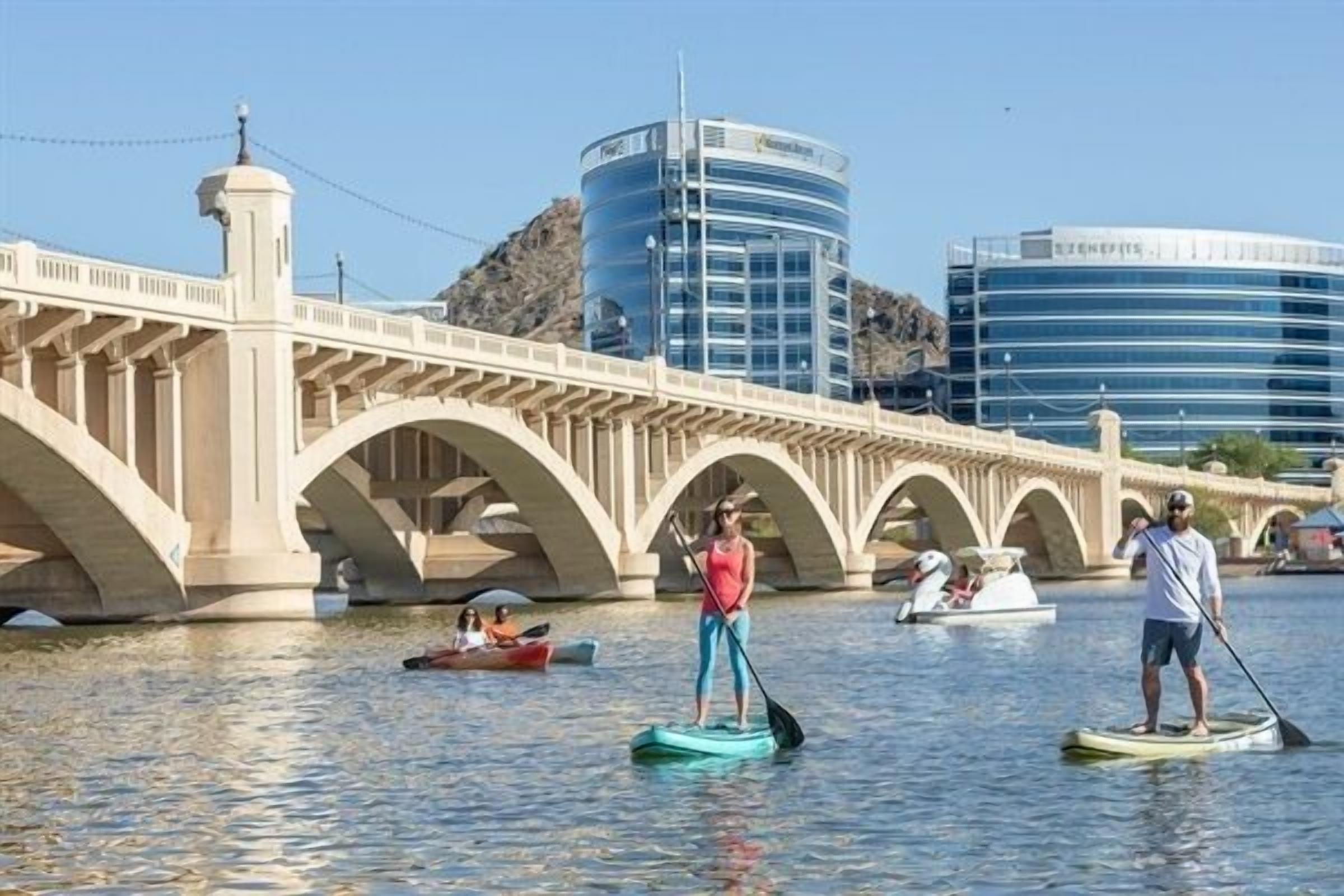 A bridge with multiple arches over a body of water.