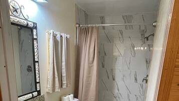 Shower, hair dryer, towels, soap