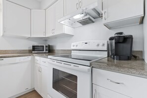 Microwave, oven, stovetop, dishwasher - Turn-Key 2BR Sarasota Oasis: Private Yard, Fully Stocked, Beaches & Downtown (Sarasota)