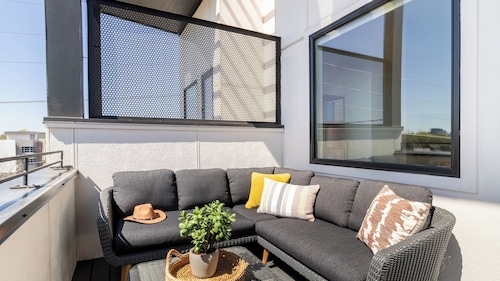 Sleeps 44 4 Themed Lofts w/ Skyline Balconies, Neon Backdrops & Glam Kitchensperfect for Nashville Group Stays The Swift Retreat by Avantstay