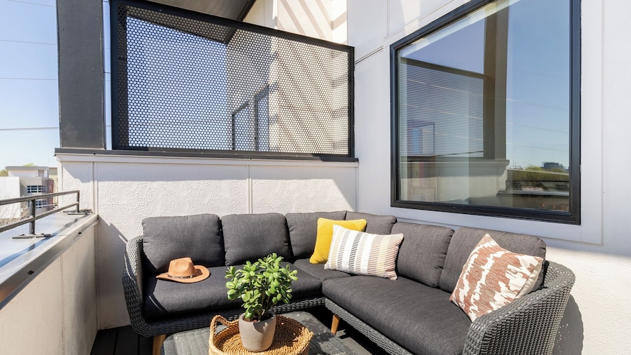 Sleeps 44 4 Themed Lofts w/ Skyline Balconies, Neon Backdrops & Glam Kitchensperfect for Nashville Group Stays The Swift Retreat by Avantstay