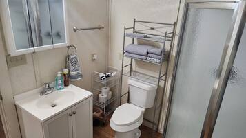 Shower, hair dryer, towels, soap