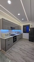Family Apartment, 4 Bedrooms, Non Smoking, Oceanfront | Private kitchen | Full-size fridge, oven, stovetop, toaster