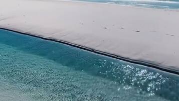 On the beach, sun loungers, beach towels