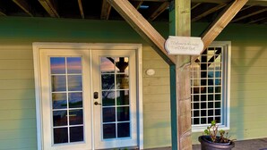 A building entrance with a sign reading "Welcome to the suites at Whale Rock." - Ocean-view studio near redwoods and beaches—your basecamp for Trinidad adventure. (Trinidad)