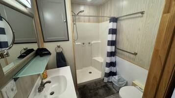 Shower, towels, soap, toilet paper