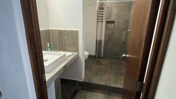 Shower, towels, soap, toilet paper