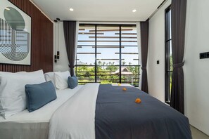 A modern hotel room with a large bed, a view of the outdoors, and a contemporary art piece on the wall. - Villa Sevu 6 (Cemagi)